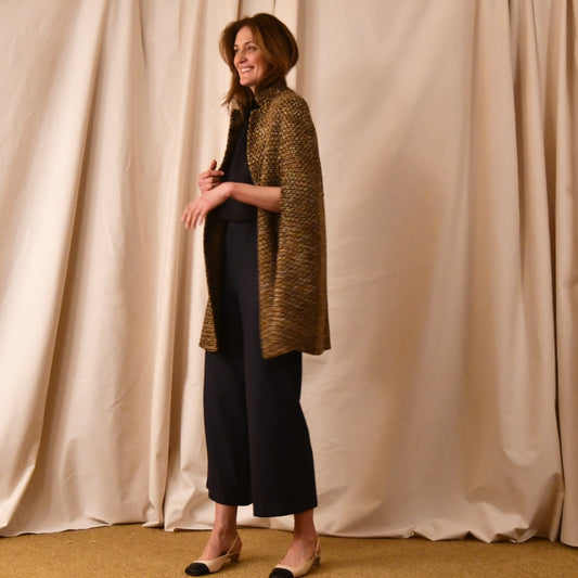 The Long Clayton Cape in Golden Linton Tweeds Boucle. A mid length, easy to wear cape for dressing up or down, mid-season and summer wear. Handmade in Britain. Side View