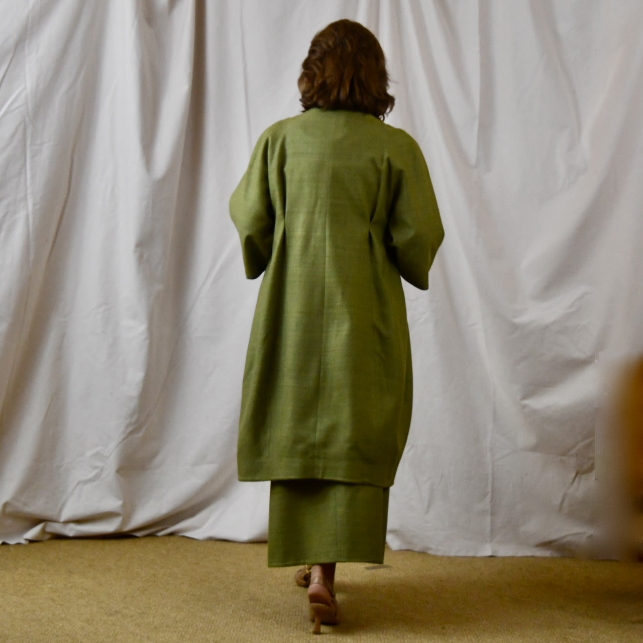 Green Silk Summer Weight Cocoon Coat with under-bust gathers and gather detail at rear. Handmade in Britain. Rear View.