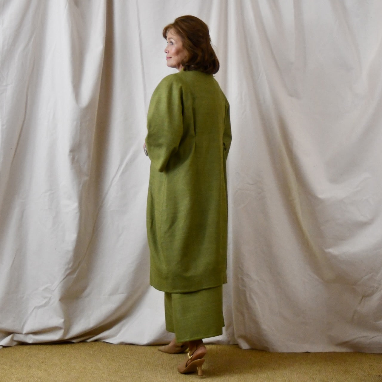 Green Silk Summer Weight Cocoon Coat with under-bust gathers and gather detail at rear. Handmade in Britain. Side View.