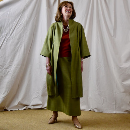 Green Silk Summer Weight Cocoon Coat with under-bust gathers and gather detail at rear. Handmade in Britain. Shown With Burnt Brick Tulip Sleeve Top. Open View