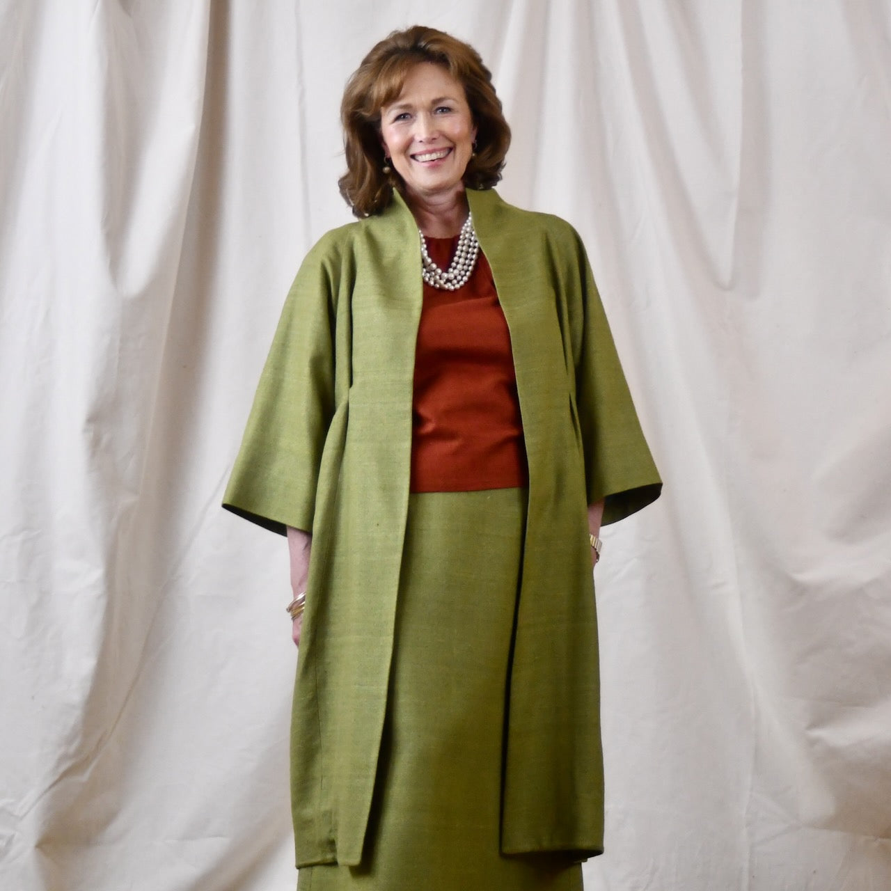Green Silk Summer Weight Cocoon Coat with under-bust gathers and gather detail at rear. Handmade in Britain.