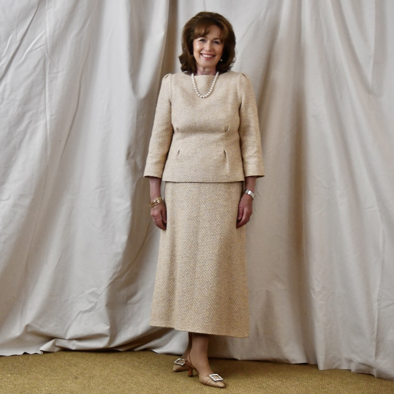 A Tailored Boat Neck Suit in Sand Mix Boucle from Linton Tweeds. Handmade in Britain.