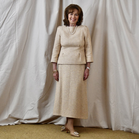 A Tailored Boat Neck Suit in Sand Mix Boucle from Linton Tweeds. Handmade in Britain.