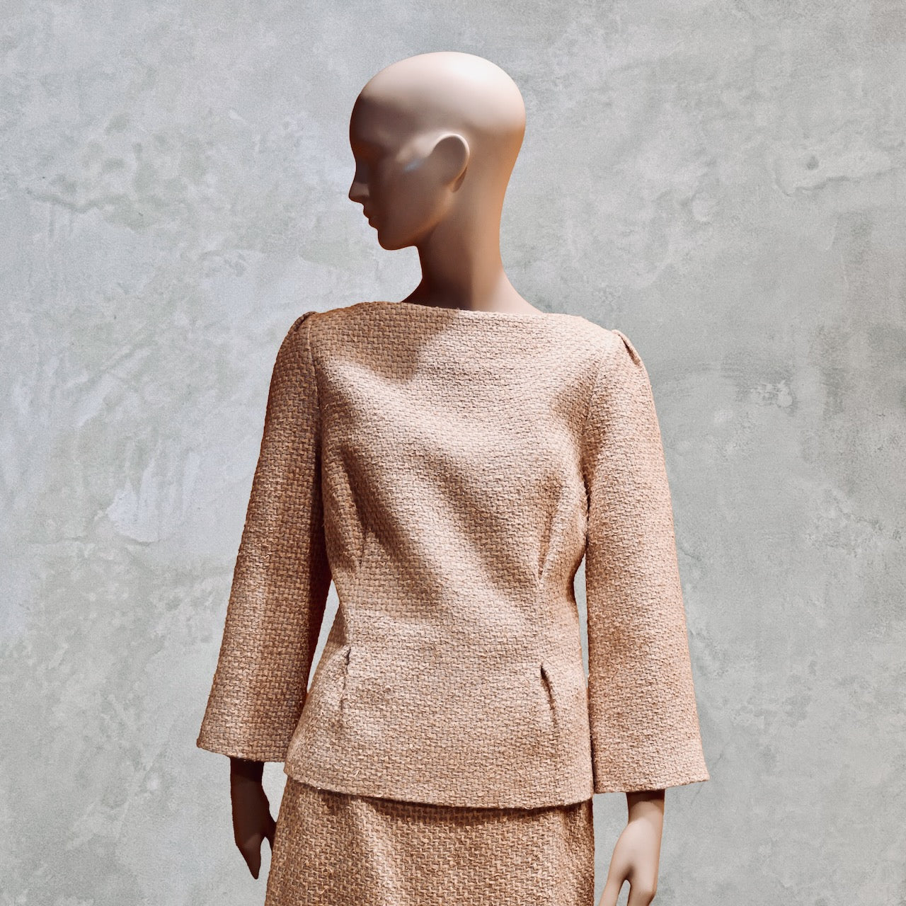 Ae Tailored Boat Neck Suit in Sand Mix Boucle, a textured spring-summer ensemble with a boat neck top and matching calf-length skirt. Handmade in Britain. Linton Tweeds Fabric.