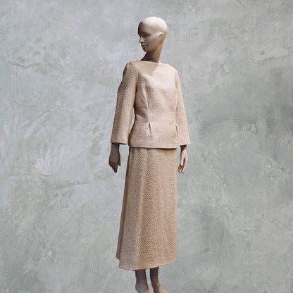 A Tailored Boat Neck Suit in Sand Mix Boucle from Linton Tweeds. Handmade in Britain.