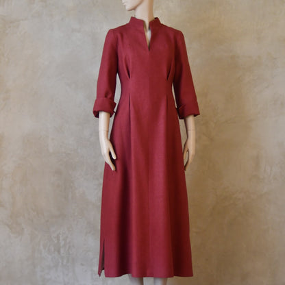 Formal summer dress in pure silk. Handmade in London this pink dress has a nipped in waist, mid length sleeves, turn back cuffs and gently flattering inverted darts at the rear. Slits to the side and an open neckline with a Nehru collar. 