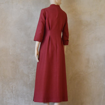 Angled back view of Dark Pink Silk Waisted longer length mid-season tailored dress. Ready to Ship and Made to order. Sizes 6 to 20 and bespoke. Made by hand in East London.