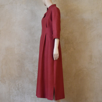 Angled view of Dark Pink Silk Waisted longer length mid-season tailored dress. Ready to Ship and Made to order. Sizes 6 to 20 and bespoke. Made by hand in East London.