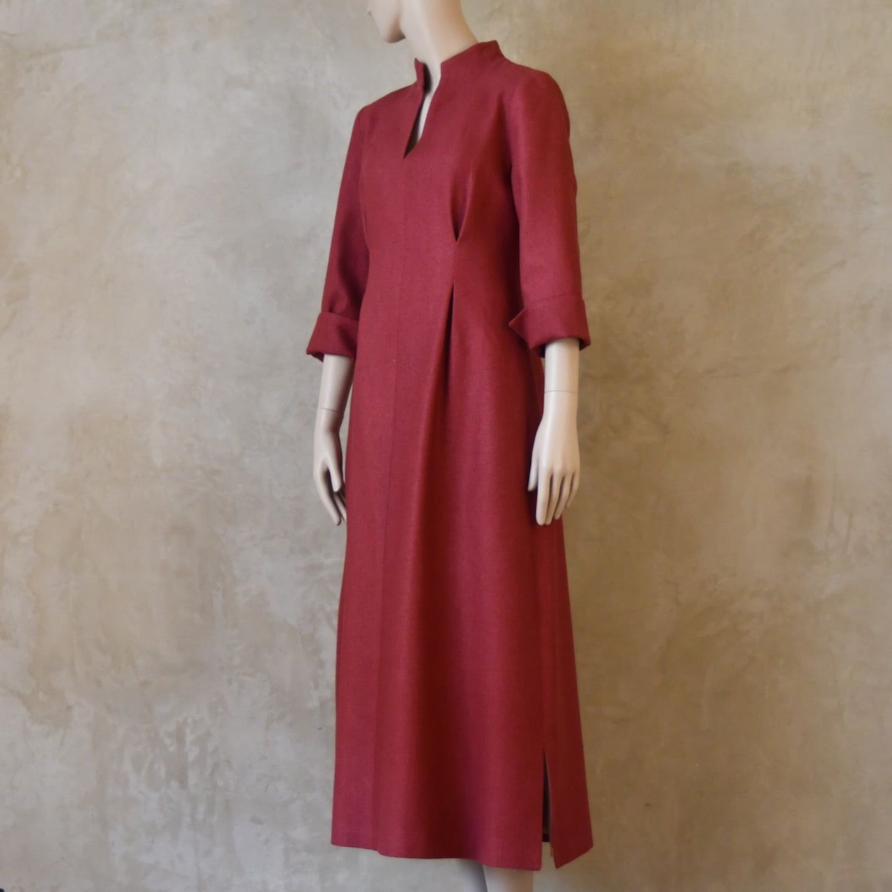 Angled front view of Dark Pink Silk Waisted longer length mid-season tailored dress. Ready to Ship and Made to order. Sizes 6 to 20 and bespoke. Made by hand in East London.