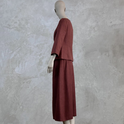 A Tailored Boat Neck Skirt Suit in Damson Silk Matka, featuring a loose top and matching A-Line skirt. Handmade in Britain. 