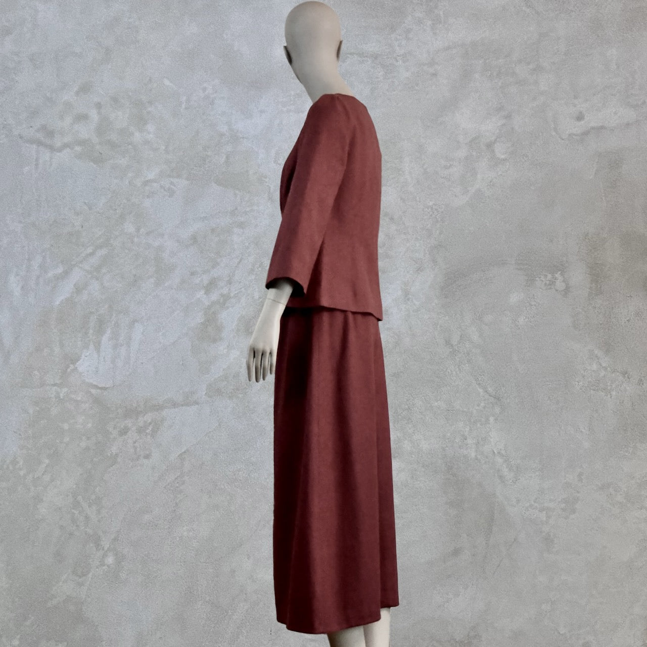 A Tailored Boat Neck Skirt Suit in Damson Silk Matka, with a matching ankle-length A-line skirt. Handmade in Britain. Left Side view.