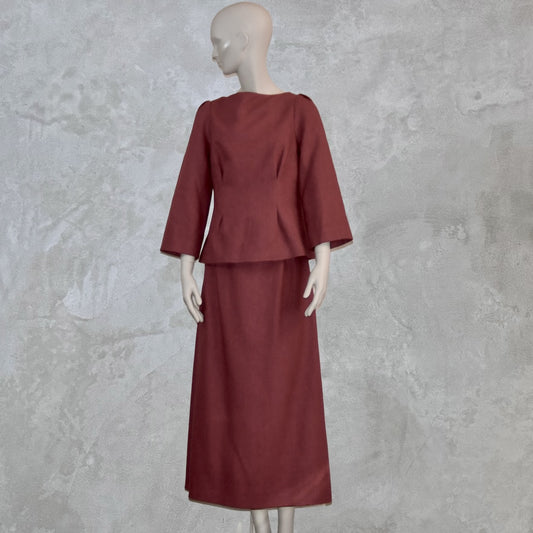A full view of a Tailored Boat Neck Skirt Suit in Damson Silk Matka, featuring a fitted long-sleeve top and matching skirt. Handmade in Britain.