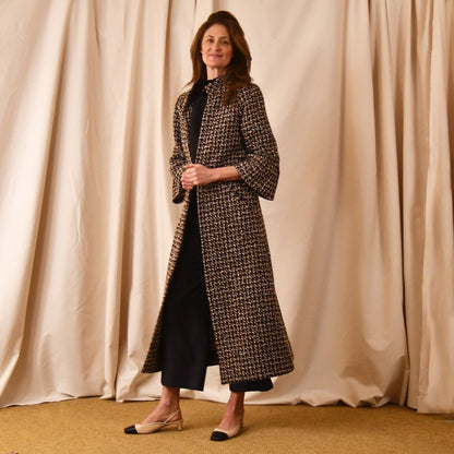 Bell Sleeve A-Line Coat in Check Linton Tweeds Boucle. Longer length ivory check boucle coat with frill cuff detail on sleeve – the perfect coat for evening wear and smart occasions. Entirely made in Great Britain.