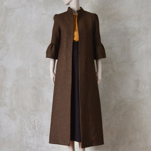 Bespoke Merino Flannel Coat by EdNerat. Handmade in London, this A-Line longer length coat has gathered details at the shoulders, bell sleeves and is lined in pure silk. Woven in Somerset  by Fox Brothers and Handmade in London.