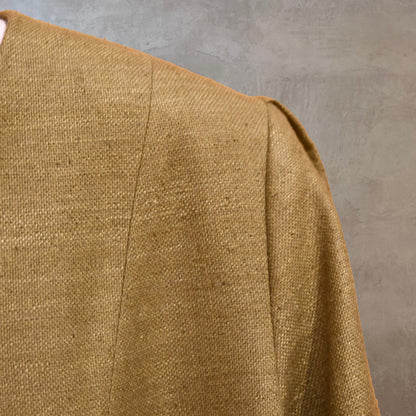 Shoulder shot showing pleated detail at top of sleeve. Pure Silk formal summer coat in size 18. With a nipped in waist detail this coat is superbly elegant and perfect for wearing at formal spring-summer occasions. Handmade in London and lined in pure silk.