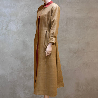 Side view of Pure Silk formal summer coat in size 18. With a nipped in waist detail this coat is superbly elegant and perfect for wearing at formal spring-summer occasions. Handmade in London and lined in pure silk.