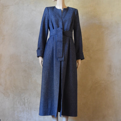 Bespoke Belted  Longer Length Blue Tweed Coat, Handmade in London. Denim Blue herringbone tweed dress coat, ideal for winter weddings, race fixtures and other formalwear occasions. Fully lined in pure silk, with optional Nehru collar, fold back cuffs and self-fabric wrap around belt.