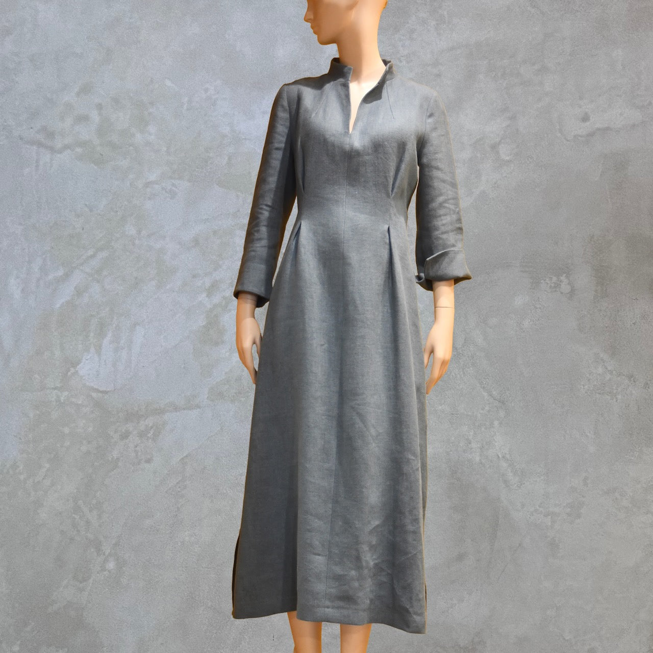 Bespoke Waisted Linen Dress with  Nehru Collar and V-Neck Front, Darted pleats to the front and three Quarter Length Sleeves.
Pure Irish Linen.
Handmade in London
Entirely Made in the British Isles.
