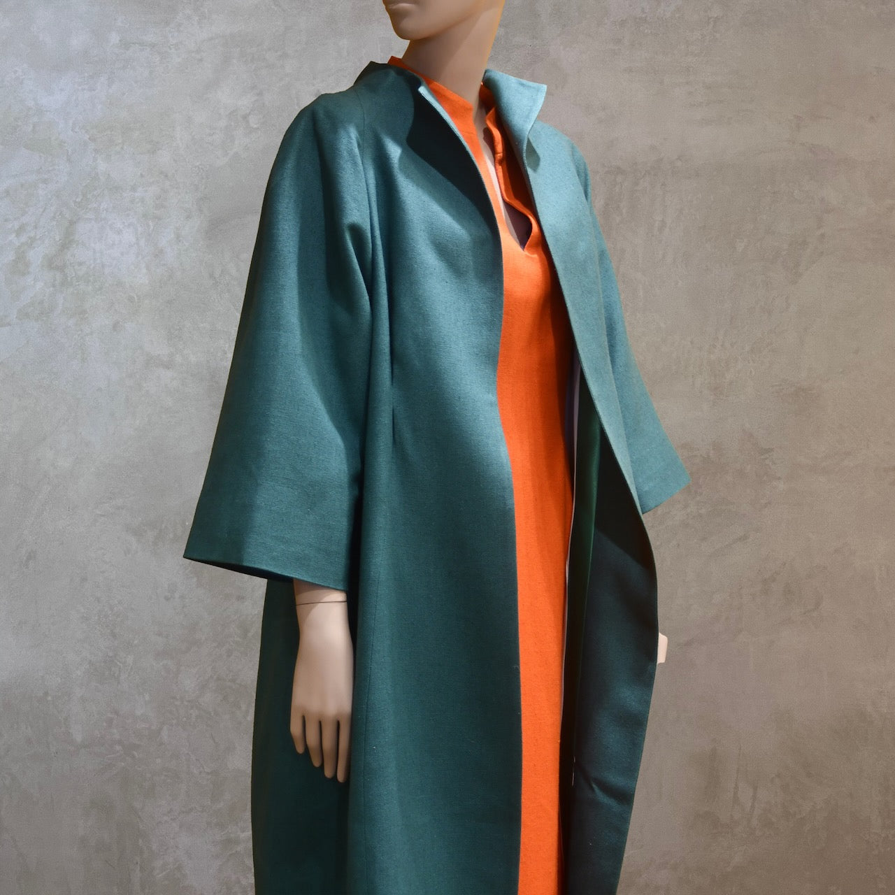 Emerald Silk Cocoon Coat. Handmade in London, this bespoke coat is fully lined in silk. Featherweight, it is ideal for summer functions.