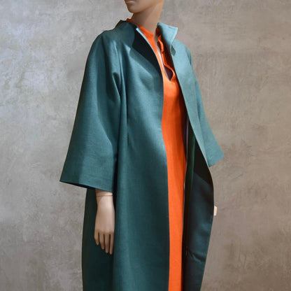 Emerald Silk Cocoon Coat. Handmade in London, this bespoke coat is fully lined in silk. Featherweight, it is ideal for summer functions.