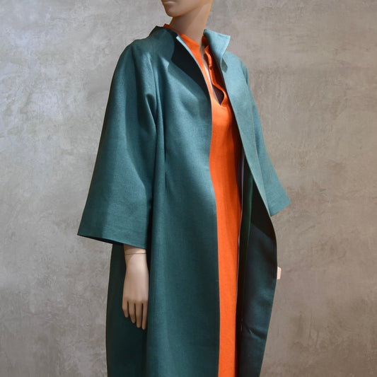 Emerald Silk Cocoon Coat. Handmade in London, this bespoke coat is fully lined in silk. Featherweight, it is ideal for summer functions.