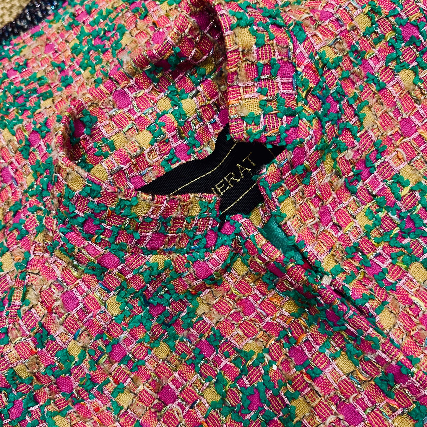 The Clayton Cape in Multicoloured Linton Tweeds Bouclé. A shorter length, easy to wear cape for dressing up or down, mid-season and summer wear. Handmade in Britain. Fabric Close up showcasing British Craftsmanship.