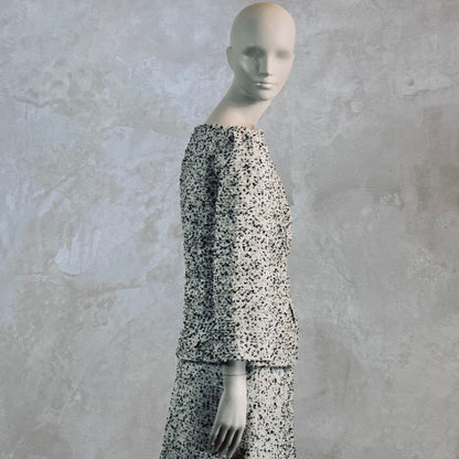 A Tailored Boat Neck Blouse in Linton Tweeds Boucle and a matching calf-length skirt. A chic, light-hued two-piece with long sleeves. Handmade in Britain.