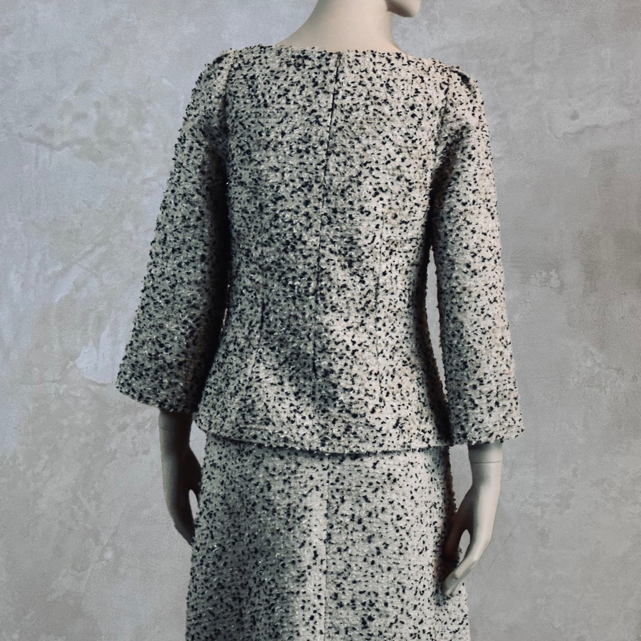 A tailored skirt suit in a light coloured Linton Tweeds bouclé – perfect for Royal Ascot and other formal occasions in spring and summer. Handmade in Britain. Back View of Top