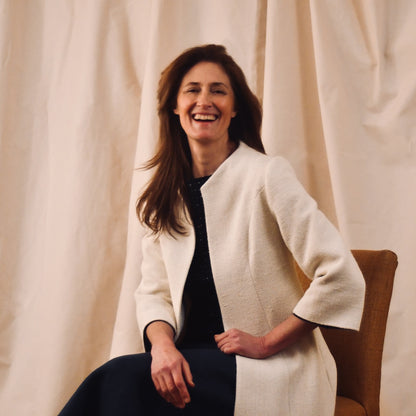 Trapeze Swing Coat in White Silk Boucle
White MidLength Swing Coat with slight vintage feel and flattering seaming details to front and rear. The perfect transitional piece - smart enough for the best occasions, easy enough to wear every day. Handmade in Great Britain. Seated View.