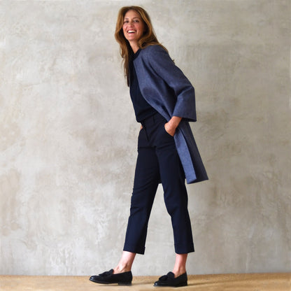 Trapeze coat in Blue Yorkshire Tweed. With a denim blue herringbone patterning, the supple tweed falls gracefully on this Bespoke Coat which is Handmade in Britain.