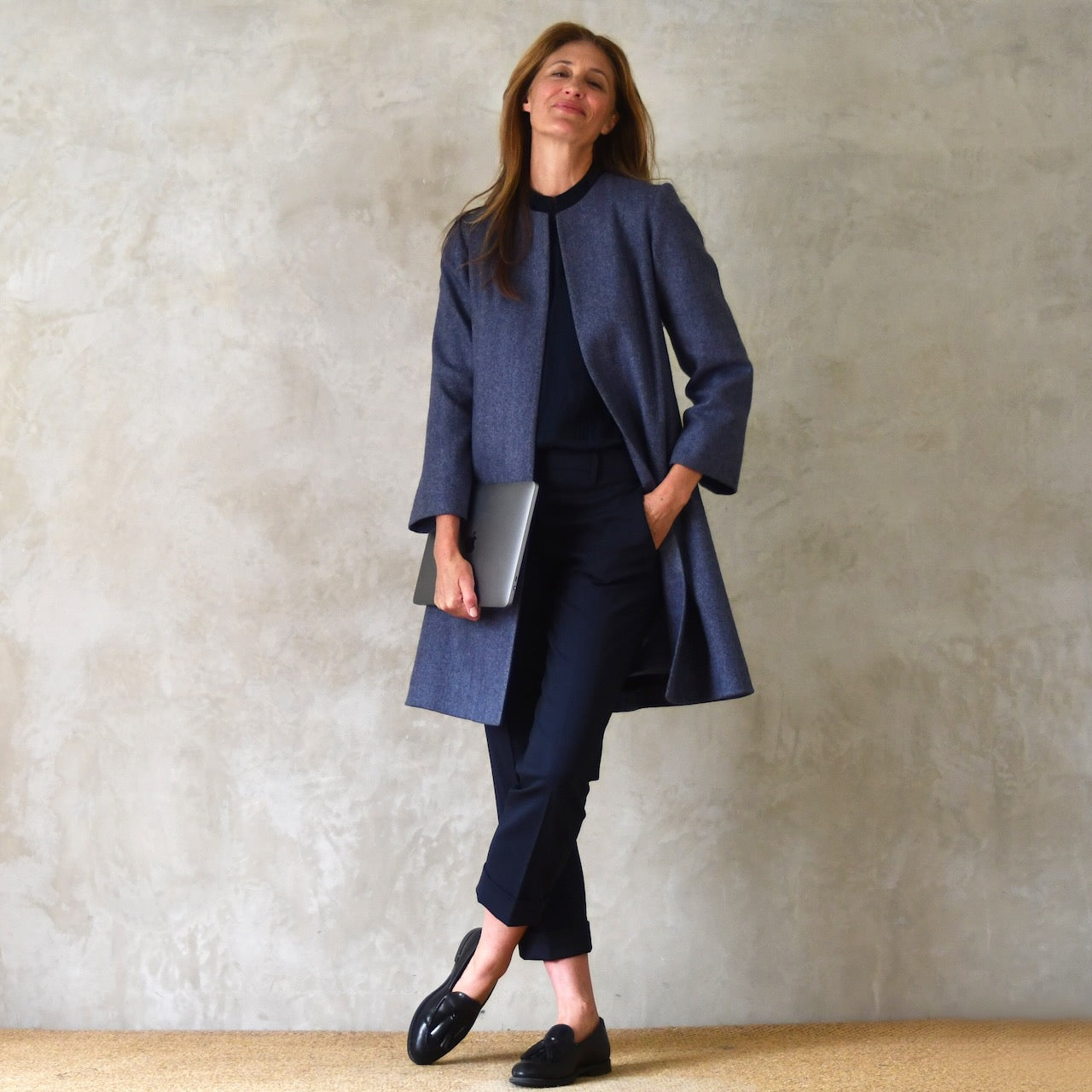 Trapeze coat in Blue Yorkshire Tweed. With a denim blue herringbone patterning, the supple tweed falls gracefully on this Bespoke Coat whic is Handmade in Britain.