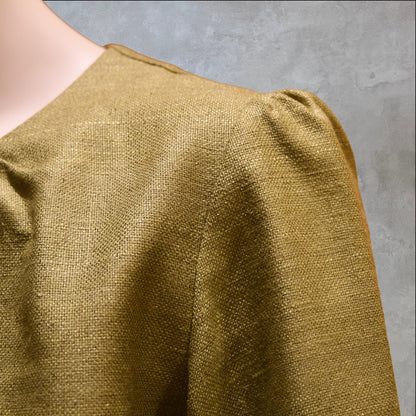 A Gathered Neck, Puff Sleeve Blouse in Green Silk Matka. Shoulder detail. Handmade in Britain. 