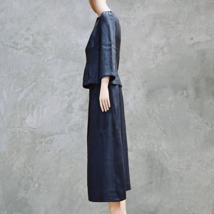 Side view of bespoke Navy Tailored Linen Skirt Suit showing boatneck peplum shaped cop over longer length A-Line Skirt. Cut, Made and Finished by Hand n London, bespoke lengths and sizes are also available.