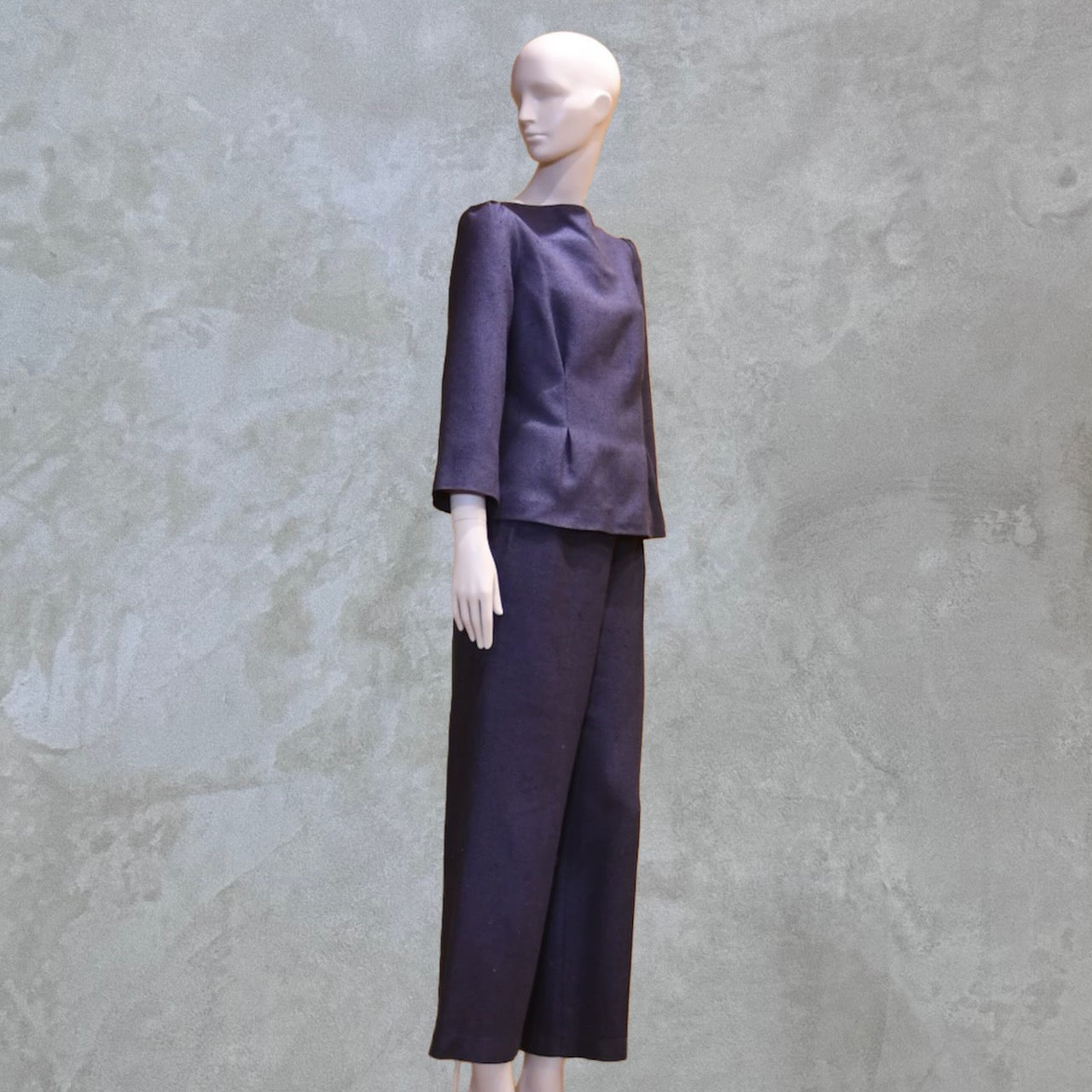 Bespoke Tailored Silk Linen separates featuring a Tailored Boat Neck Blouse in inky blue silk with matching pants. Handmade in Britain. Side View.