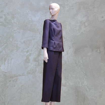 Bespoke Tailored Silk Linen separates featuring a Tailored Boat Neck Blouse in inky blue silk with matching pants. Handmade in Britain. Side View.