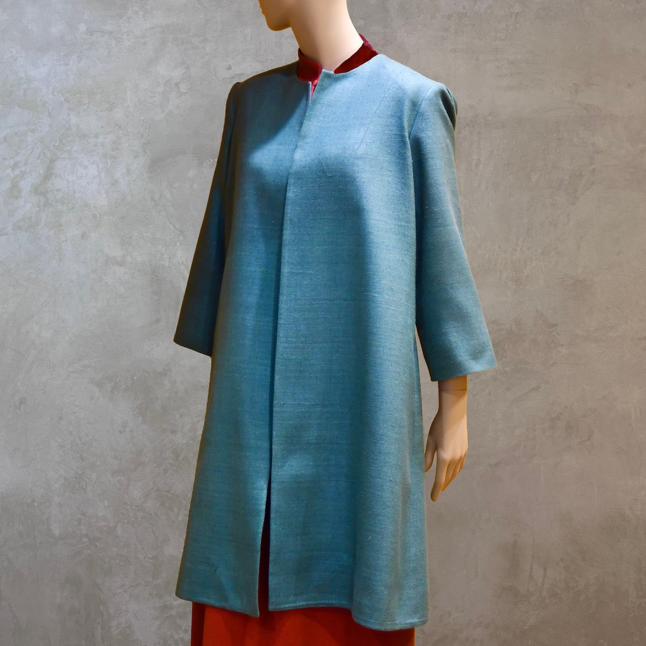 Front View of Emerald Green silk car coat. A Perfect summer weight coat - ideal for weddings, work and more. Hand made in London. Lined in pure silk.