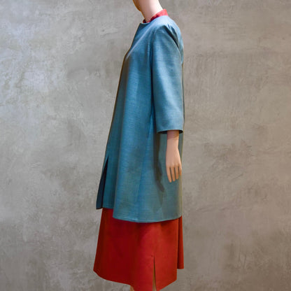 Side on view of Emerald Green silk car coat. A Perfect summer weight coat - ideal for weddings, work and more. Hand made in London. Lined in pure silk.