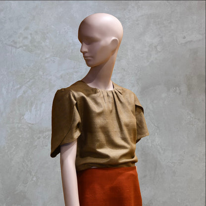 A Tulip Sleeve Blouse in Khaki Silk Matka. Handmade in Britain. Shown with contrast coloured silk skirt.