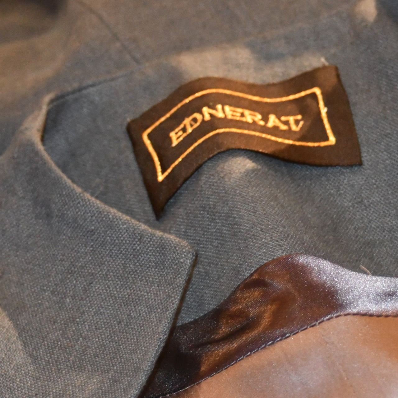 NavyLinenCocoon Coat - Lining View. Shorter length cocoon coat in pure irish linen. Handmade in London this coat is lined in silk, has generous shaping and can be belted at the waist.