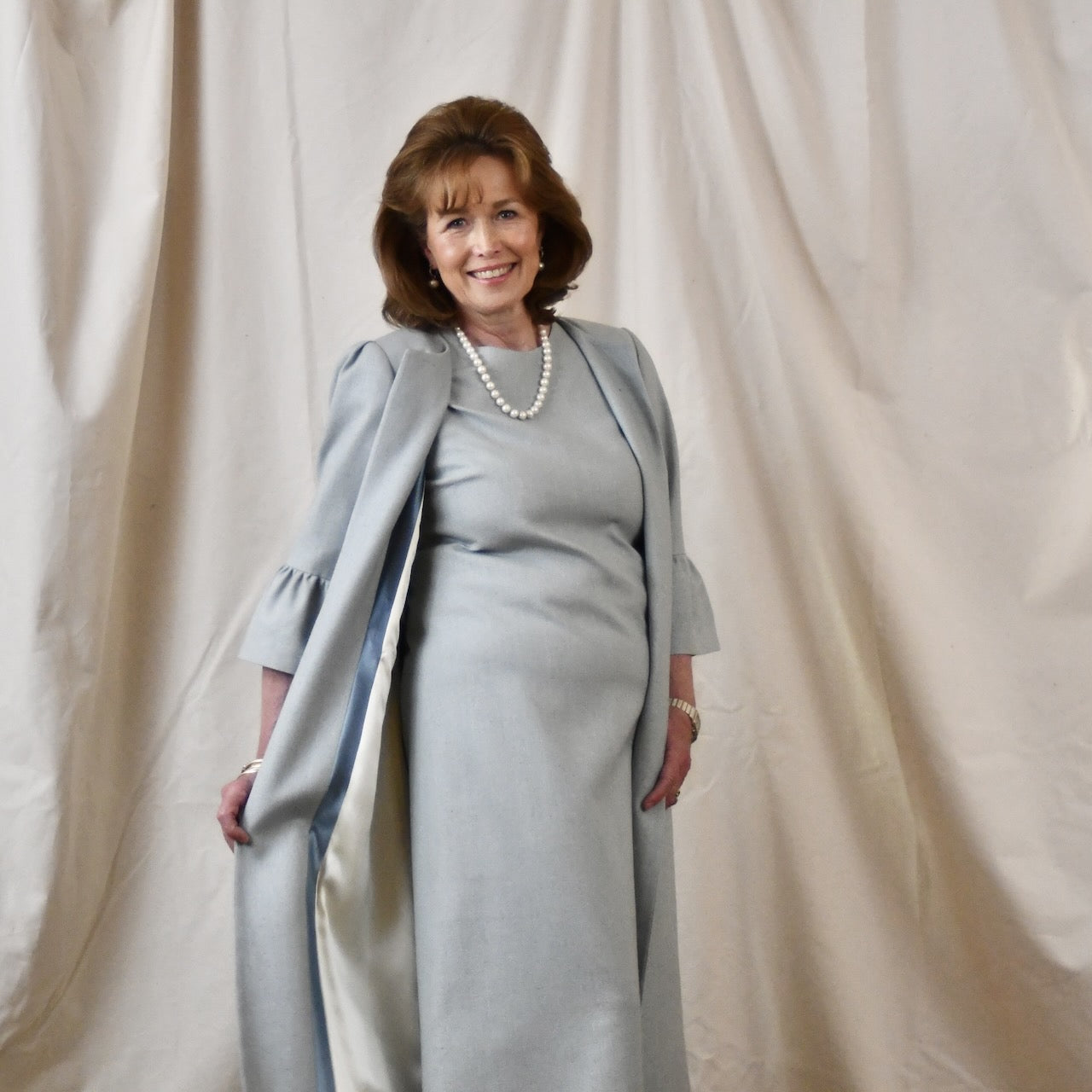 Bespoke Bell Sleeve A Line Occasion Coat in Pale Blue Silk Matka. Fully lined in Silk. Handmade in Britain. Side View Open.