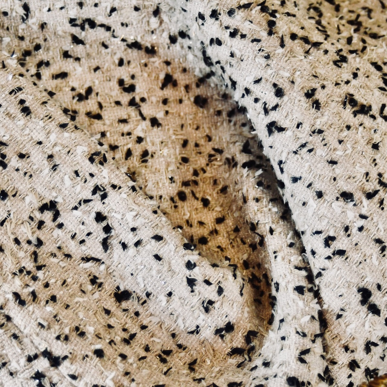 A tailored skirt suit in a light coloured Linton Tweeds bouclé – perfect for Royal Ascot and other formal occasions in spring and summer. Handmade in Britain. Fabric Close Up