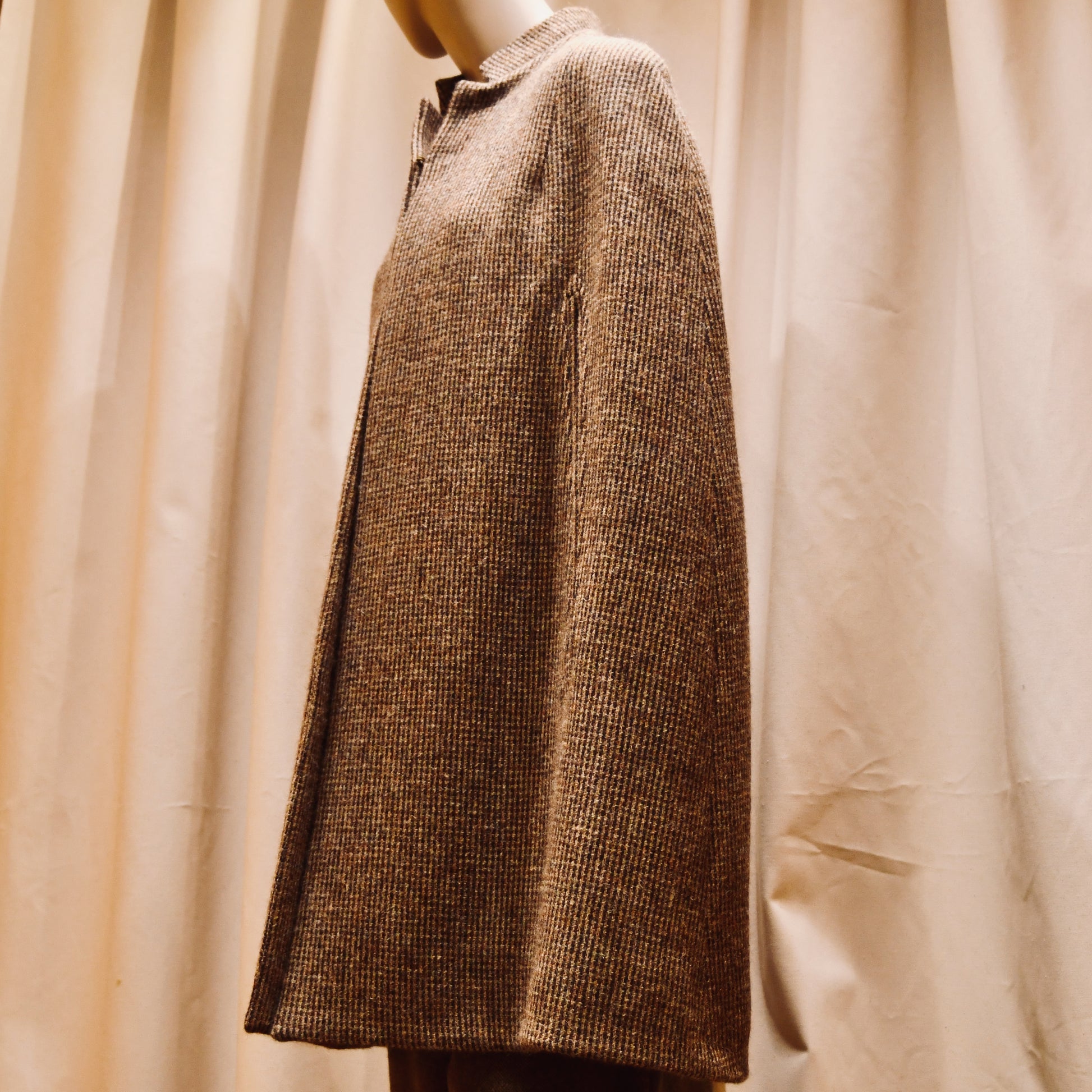 Cape in Small Brown Check Lovat Tweed, featuring a collar. Handmade in Britain.