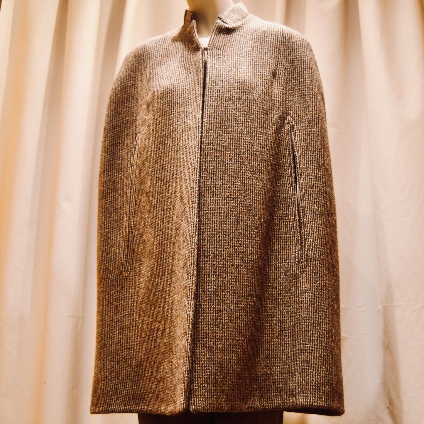 Swing Cape in Small Brown Check Lovat Tweed. Earth-toned texture and elegant style. Handmade in Britain. Front Closed View.