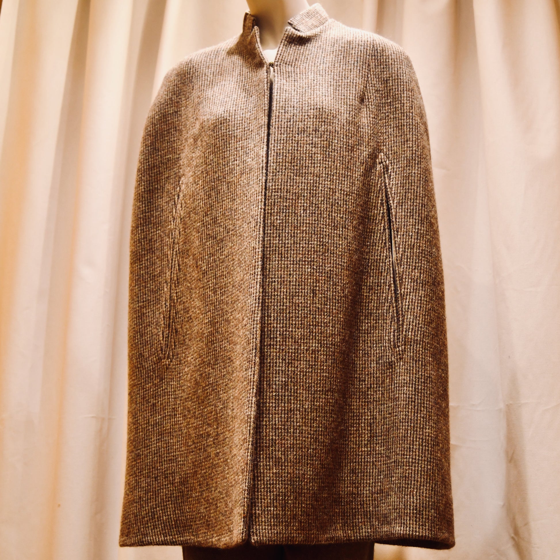 Swing Cape in Small Brown Check Lovat Tweed. Earth-toned texture and elegant style. Handmade in Britain. Front Closed View.