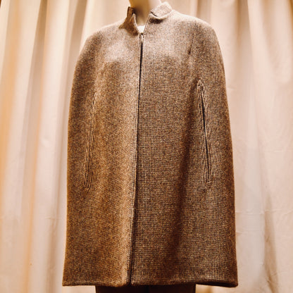 Swing Cape in Small Brown Check Lovat Tweed. Earth-toned texture and elegant style. Handmade in Britain. Front Closed View.
