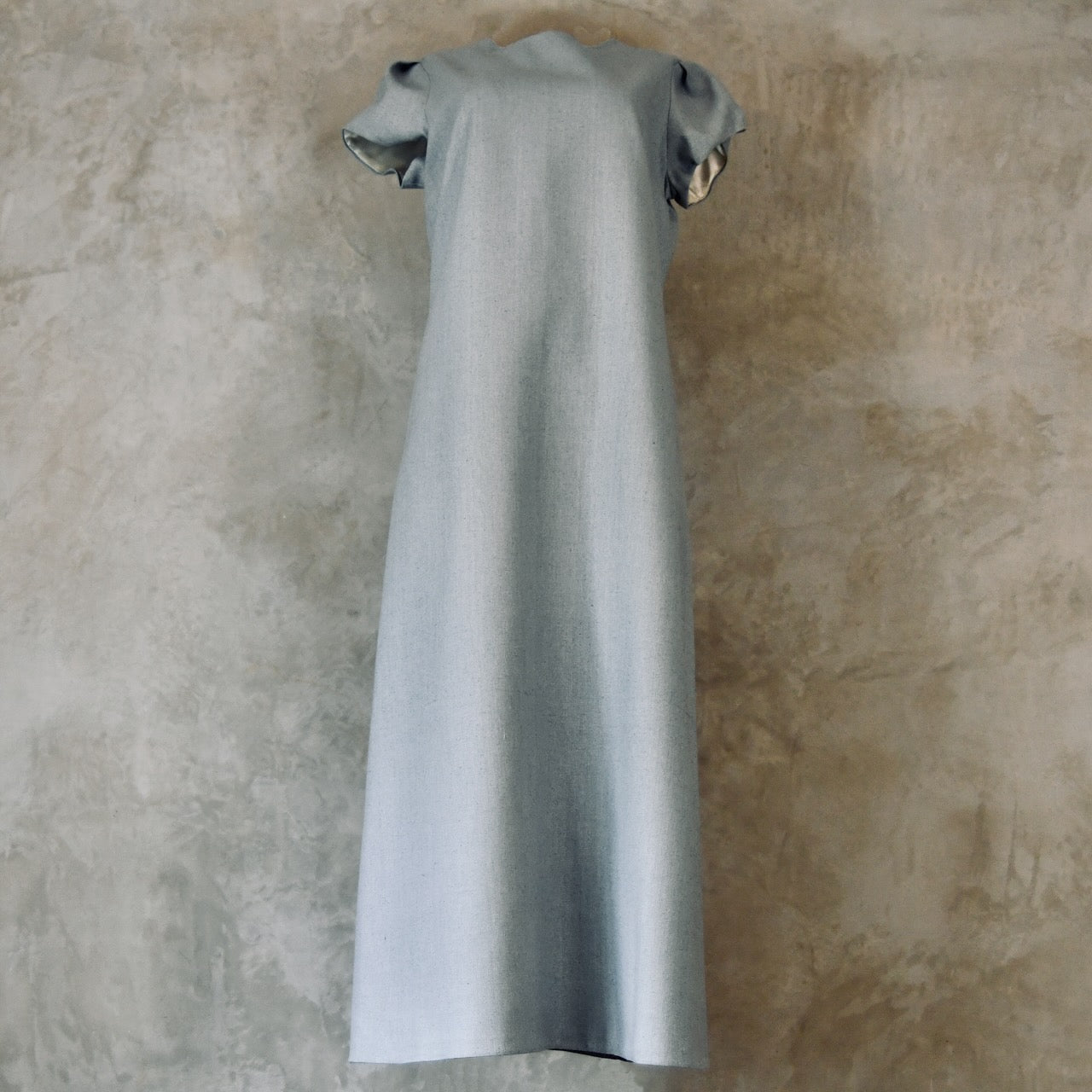 An A-Line Bell Sleeve Coat and Dress in Light Blue Silk Matka. A long, short-sleeved blue woven dress with an A-Line cut. Handmade in Britain. Dress Front-On View.