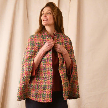 The Clayton Cape in Multicoloured Linton Tweeds Bouclé. A shorter length, easy to wear cape for dressing up or down, mid-season and summer wear. Handmade in Britain. Closed View.