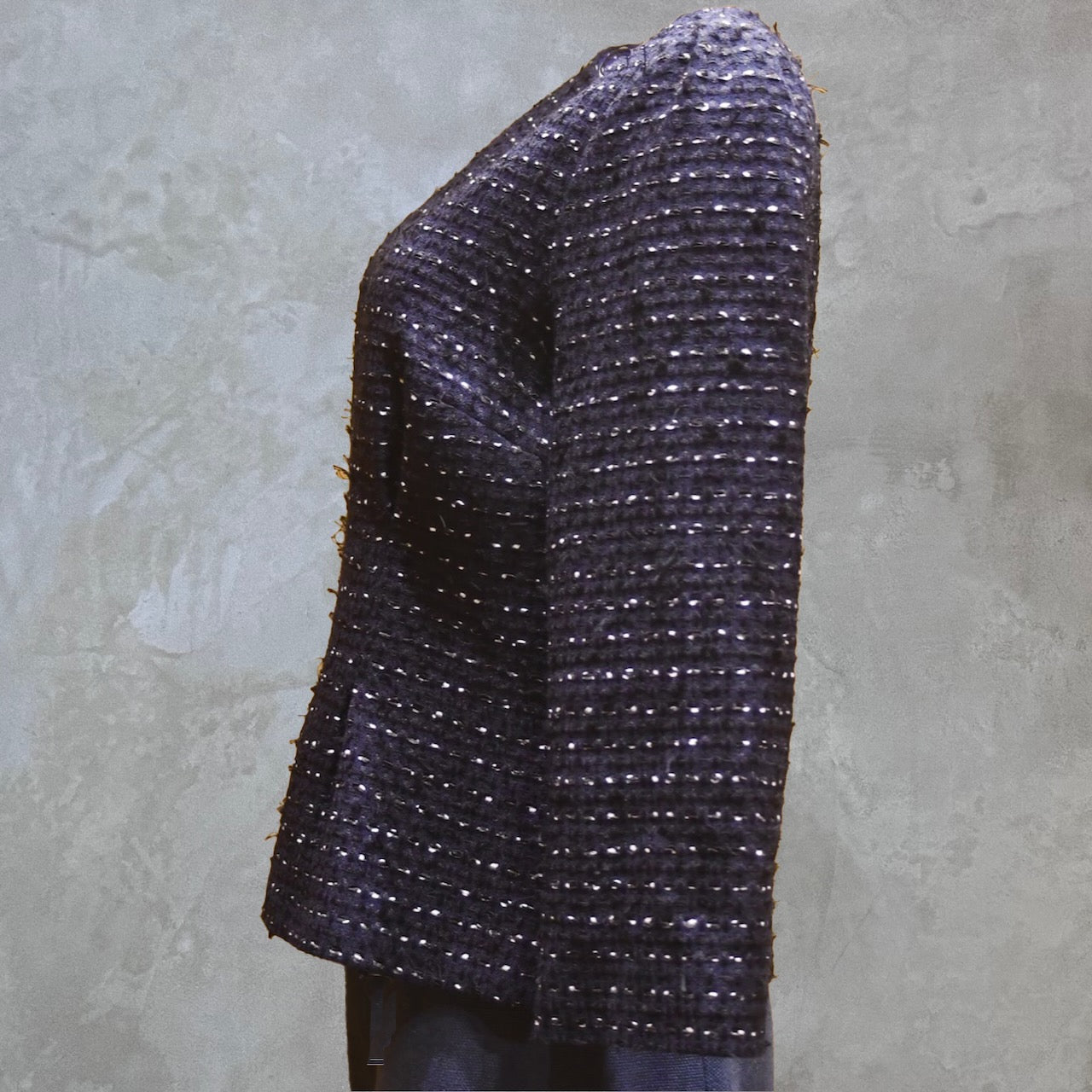 A Tailored Boat Neck Blouse in navy, black, and white cotton boucle is displayed from a side view on a mannequin. Handmade in Britain. 