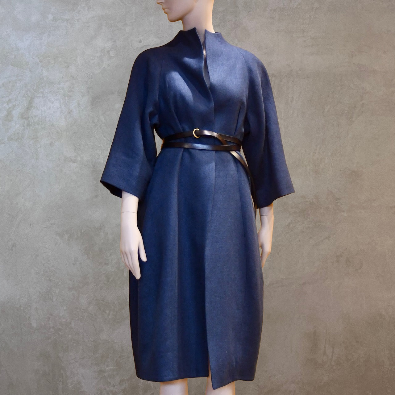 Front shot of Shorter length cocoon coat in pure irish linen. Handmade in London this coat is lined in silk, has generous shaping and can be belted at the waist.