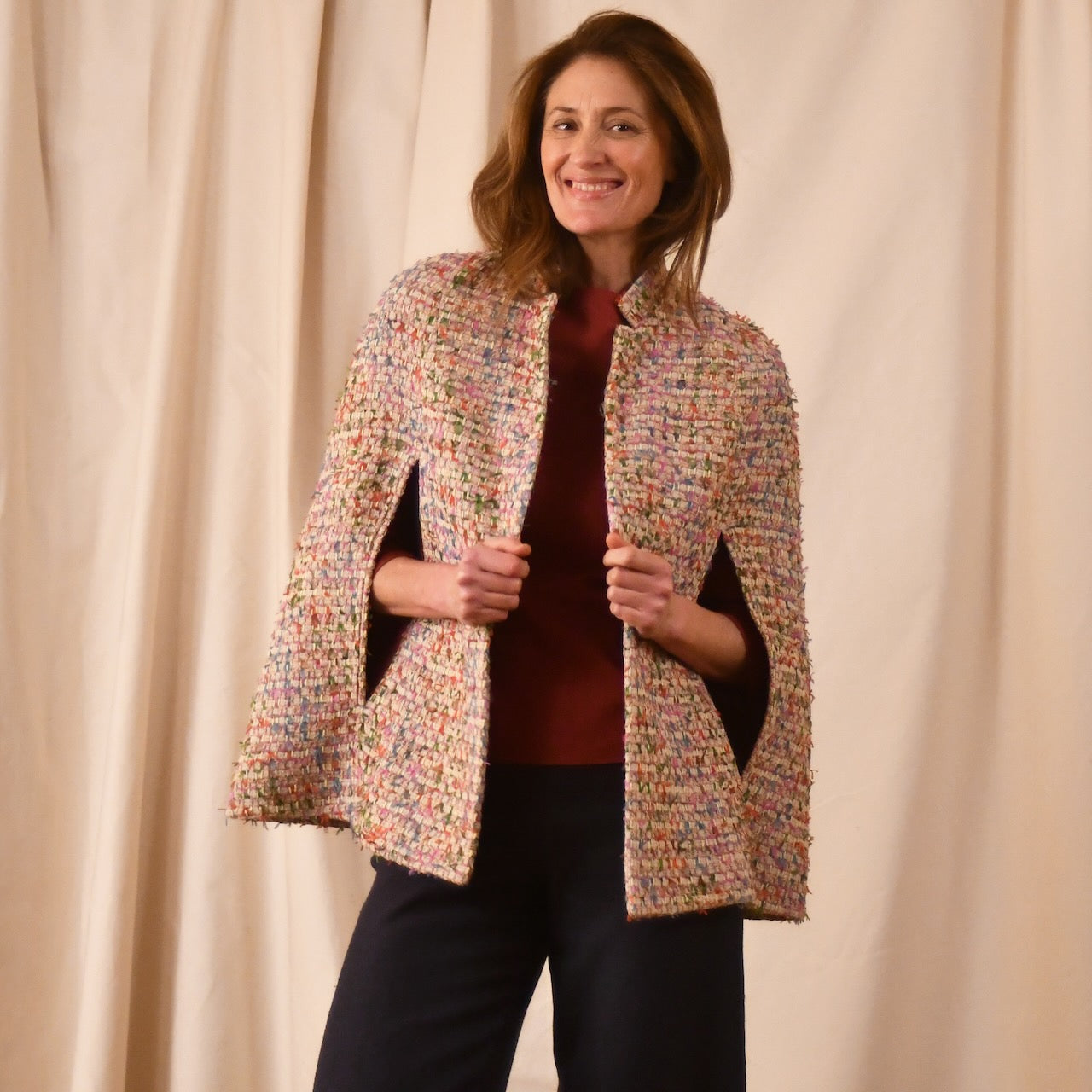 A Vintage Style Swing Cape  in Pale Multicoloured Boucle from Linton Tweeds. Fun, young and elegant. Handmade in Britain. 